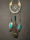 Handmade horseshoe dreamcatcher with white web, turquoise beads and peacock feather